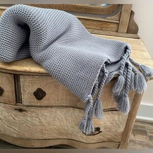 Cozy Tyme gray tasseled throw blanket